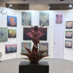 "El arte de contar historias: descubre cómo el talentoso artista oaxaqueño Manuel Miguel transforma la realidad en obras maestras de colores vibrantes"